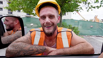 A construction employee practices a surprise as he gets orally pleasured by another guy instead of a lady