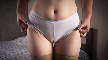 A mature chick in stocking taunts with her milky underpants unsheathing a cameltoe and hip gap up close